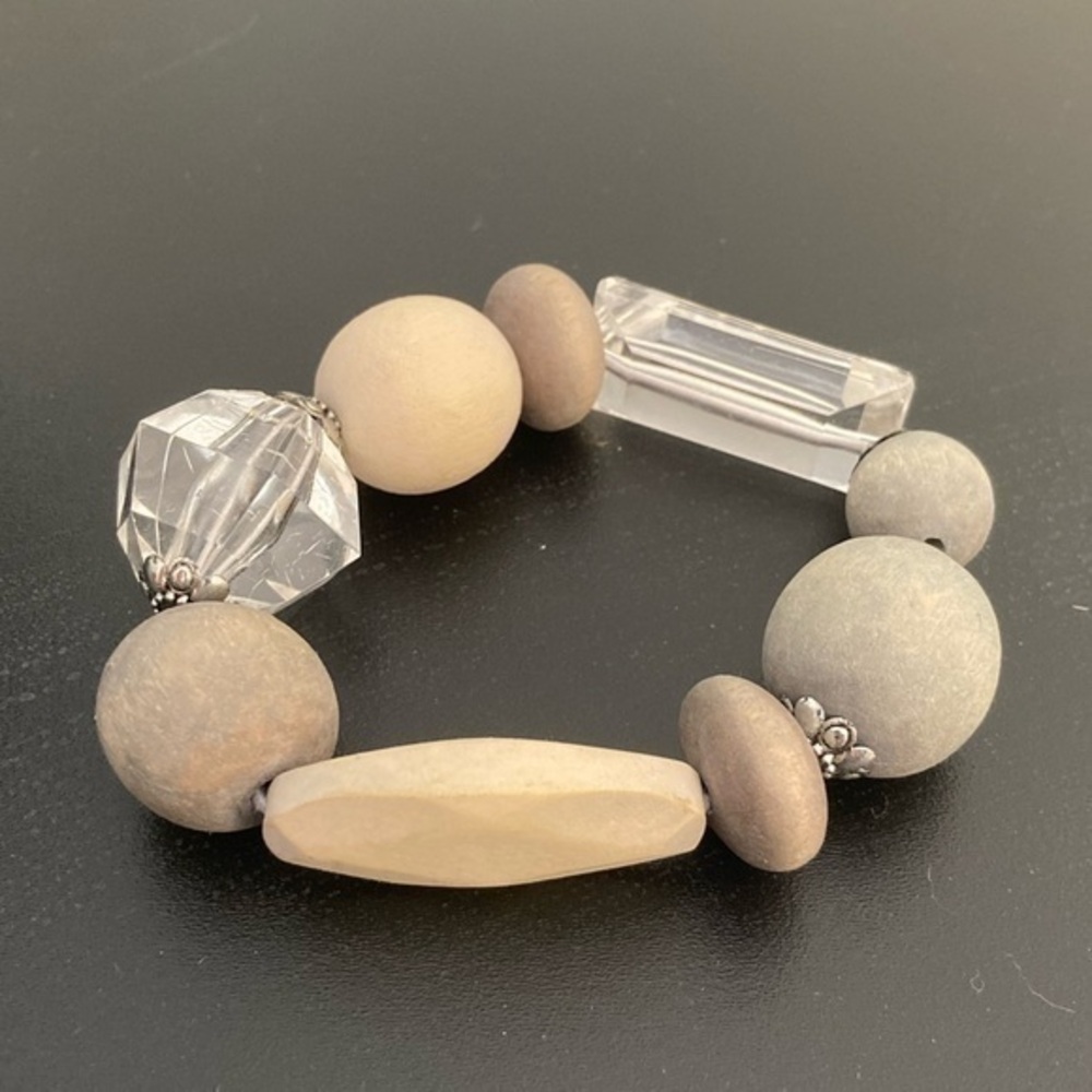 Cream colored bead bracelet.
